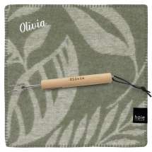 Sittunderlag från Høie i ull, tillsammans med grillpinne. Båda med samma namn.